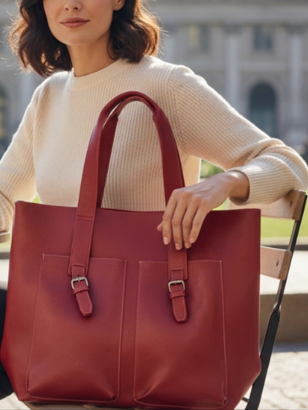 Red Elizabeth Arden tote bag features dual handle straps and twin front pockets